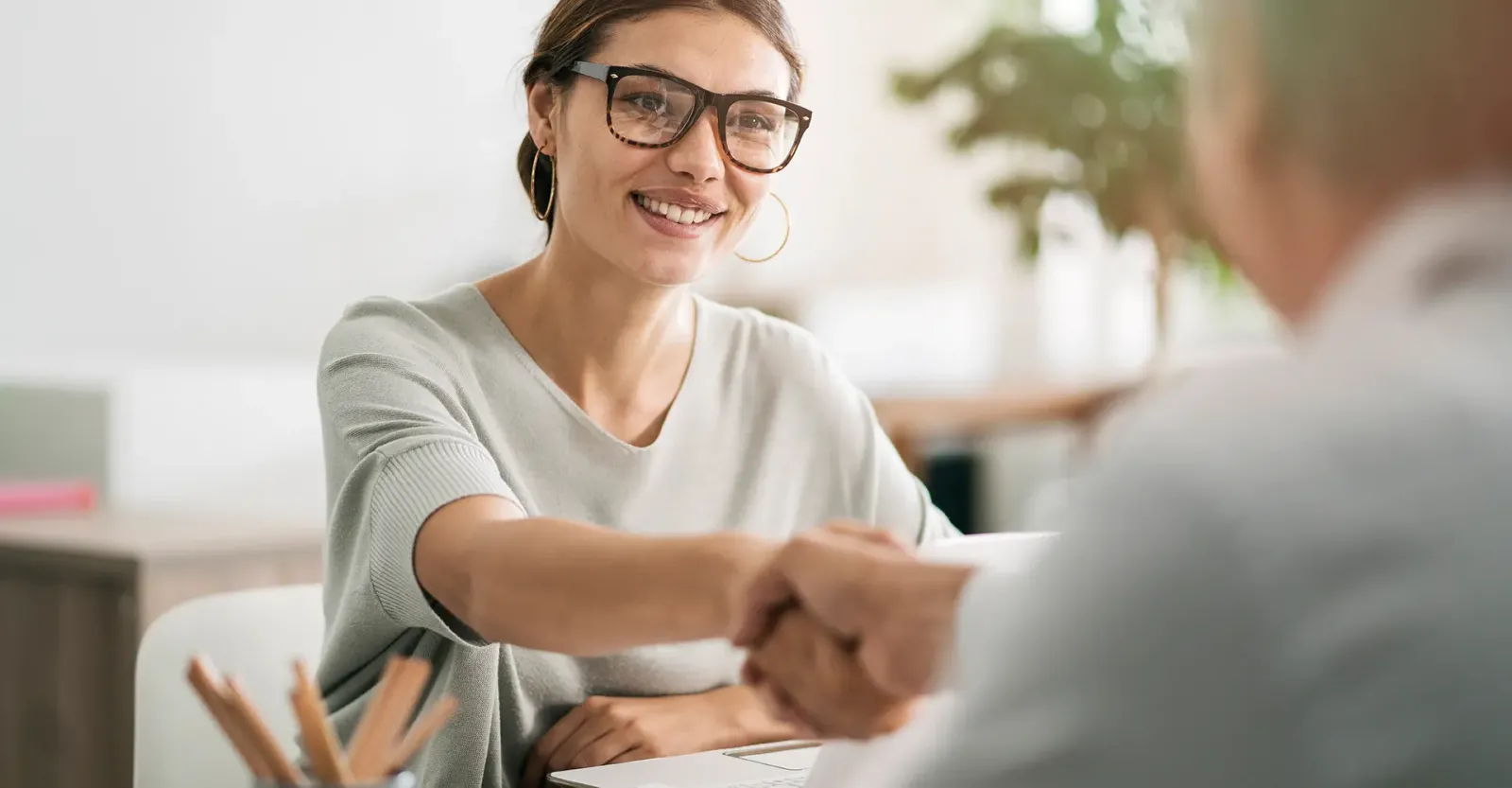 woman shaking bankers hand