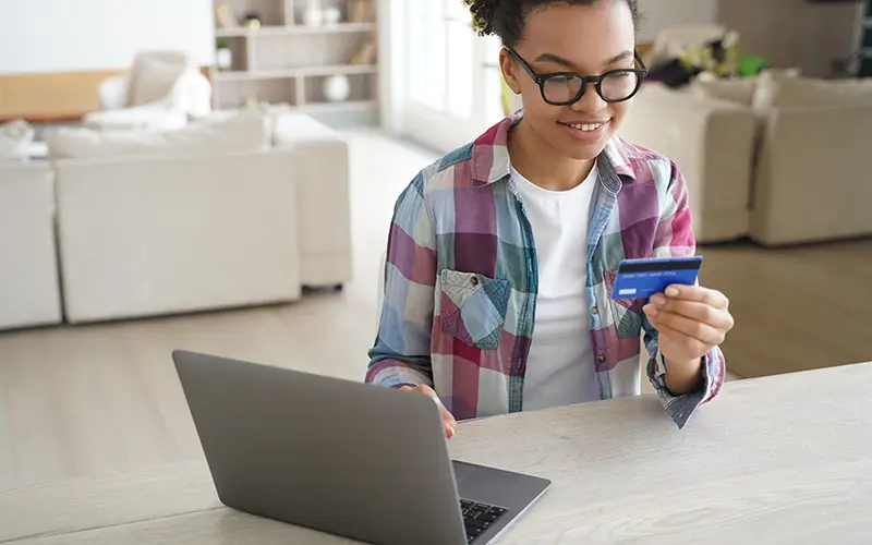 teen with debit card